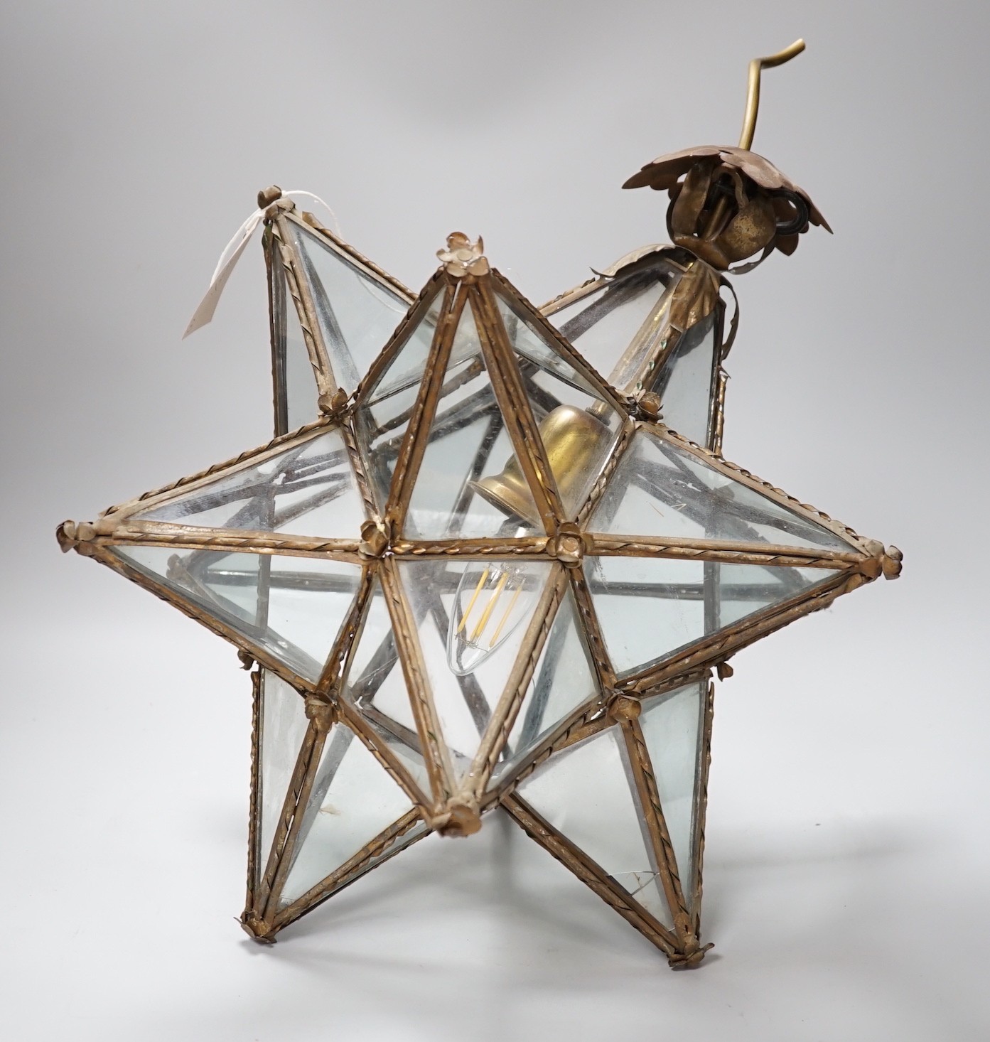 A cut glass four branch electrolier, star shaped gilt metal ceiling shade and a 1970's perspex ceiling shade